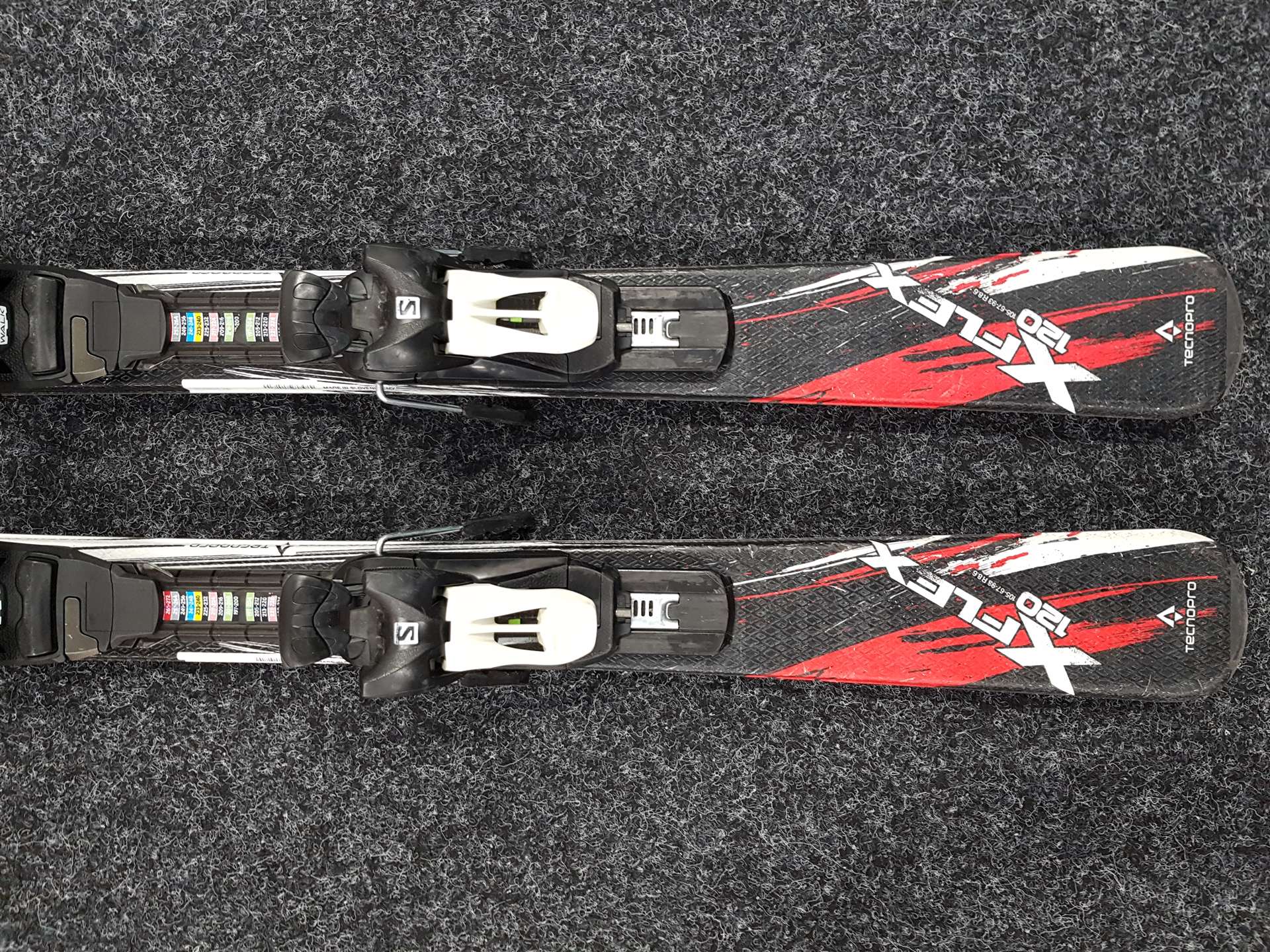 Skis enfant d'occasion TECNOPRO XT Team + fixations Salomon 4.5